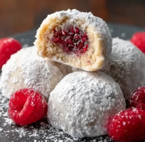 Raspberry Filled Almond Snowball Cookies